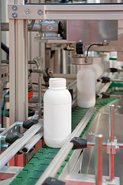 istock Mass production of white plastic bottles 119594160