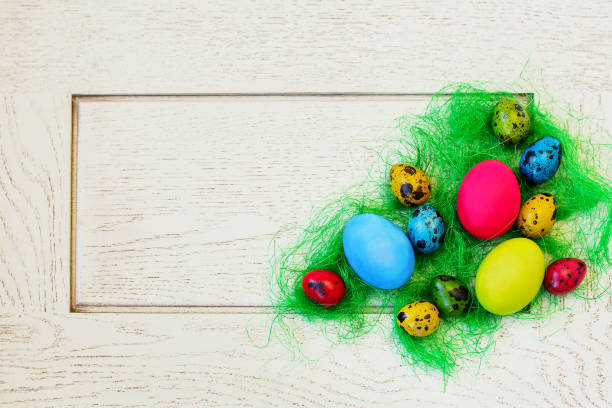 istock Easter composition of painted eggs on a white background. 1195942118