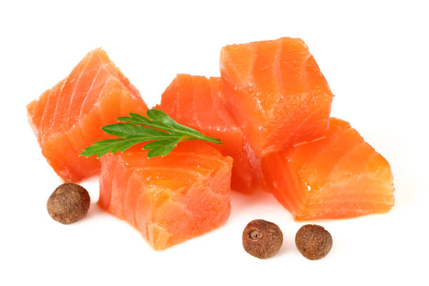 istock Red fish. Raw salmon fillet with parsley and peppercorns isolate on white background 1195945698