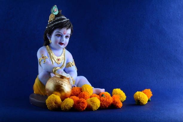 Hindu God Krishna on blue background stock photo