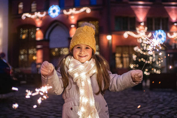 istock Happy girl with sparklers 1195950090