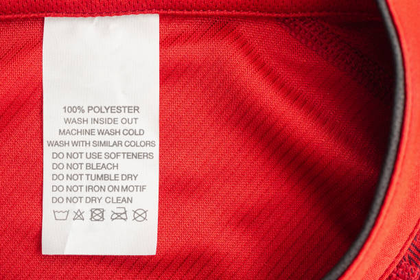 istock White laundry care washing instructions clothes label on red jersey polyester sport shirt 1195952929