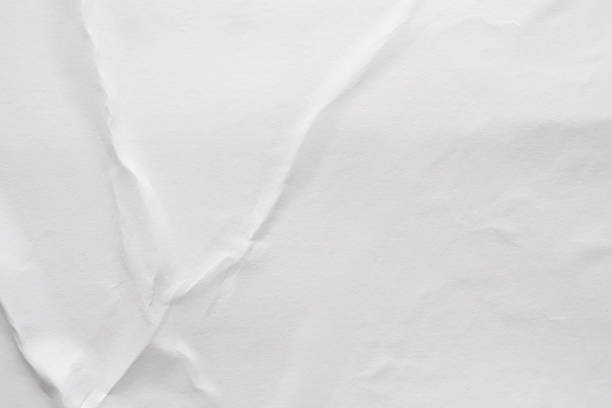 istock Blank white crumpled and creased paper poster texture background 1195952932
