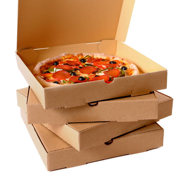 istock Freshly baked Pizza with stack of delivery boxes 1195960862