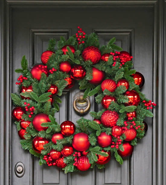 istock Christmas wreath with pine branches and colorful ornaments 1195962106