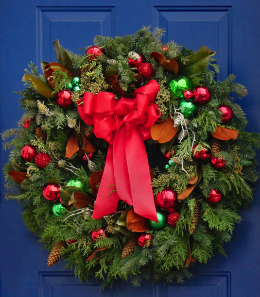 istock Christmas wreath with pine branches and colorful ornaments 1195962107