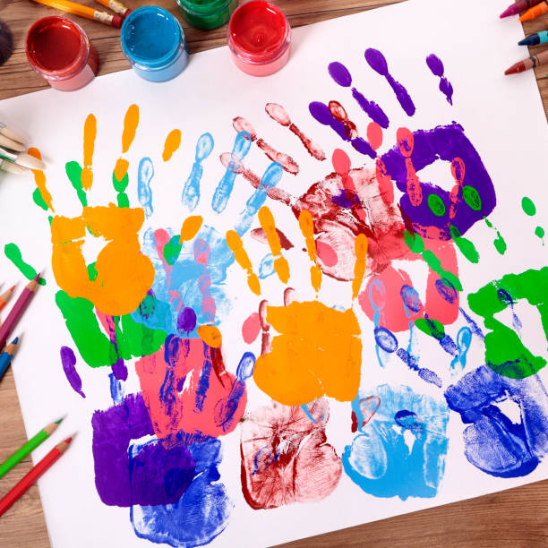 istock Handprints and art equipment 1195964290