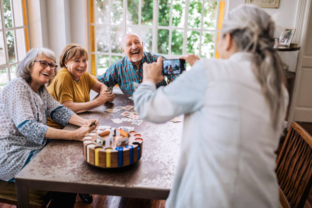 istock Young at heart seniors having fun time in nursing home 1195965537