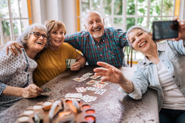 istock Young at heart seniors having fun time in nursing home 1195966186