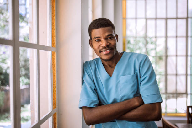 istock Black male nurse in medical scrubs 1195967310