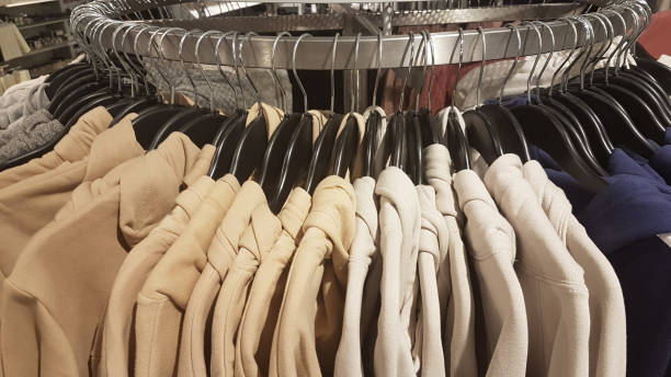 istock clothes trouses blouses in a shop  on a hanger 1195968132