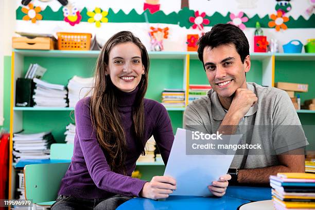 Teacher And Parent Meeting In School Classroom Stock Photo - Download Image Now - Teacher, Meeting, Preschool