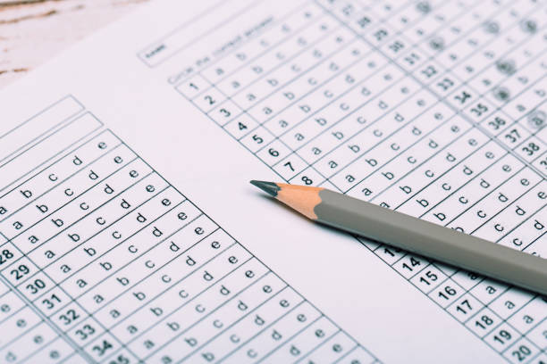 istock Fill in the answer sheet in the exam with a pencil 1195975525