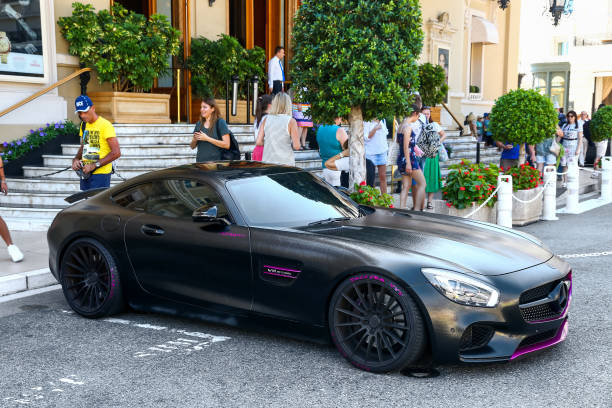Mercedes-AMG GT Coupe driving on the street of Monte Carlo in the Grand Hotel Hairpin of the Monaco race track. Panning photo with motion blur.