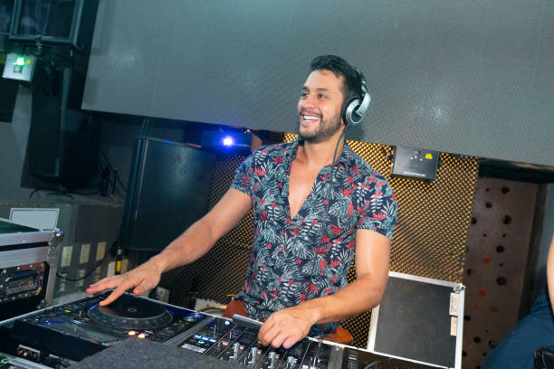 istock Disc jockey playing at the disco party 1195979272