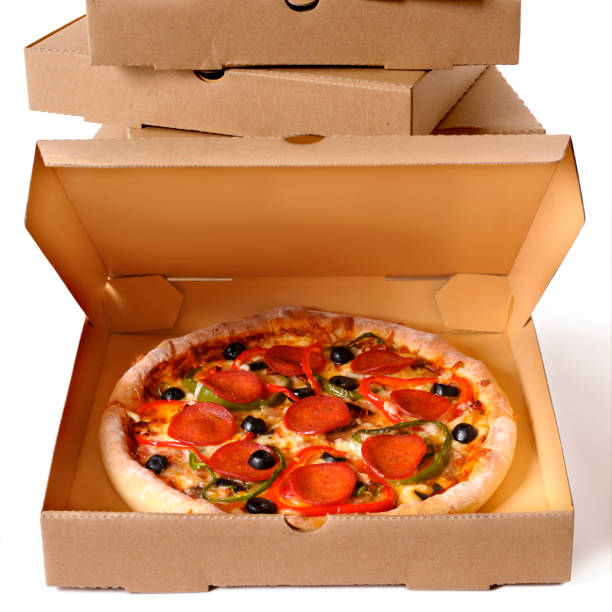 istock Freshly baked Pizza with stack of delivery boxes 1195982954