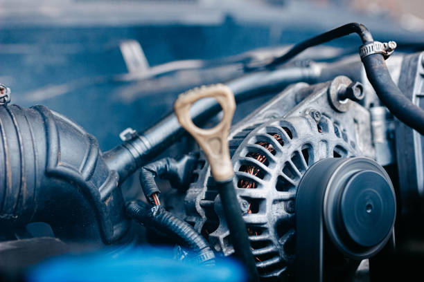 istock car generator and oil dipstick. 1195986903