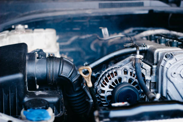 istock car generator and oil dipstick. 1195986937