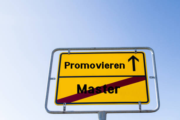 istock Sign Graduate after Masters Degree german 