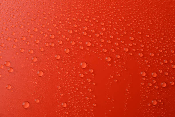 istock Many water drops on red background. Texture background. 1195996760