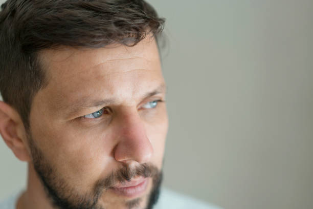 istock Close up man looking away, close up portrait 1195996866