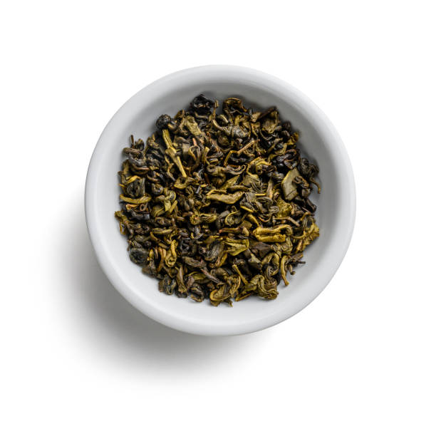 istock Green tea top view on white background 1195998968
