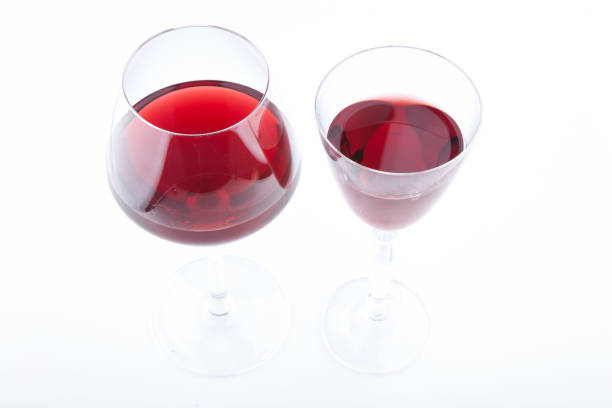 istock Two types pf Red wine glasses on white background 1195999639