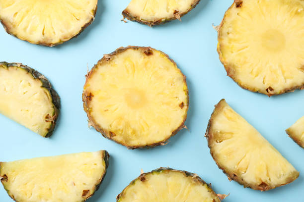 istock Flat lay with pineapple slices on blue background, top view 1196002949