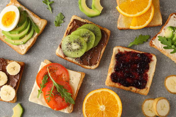 istock Delicious assorted sandwiches on grey background, top view 1196003859