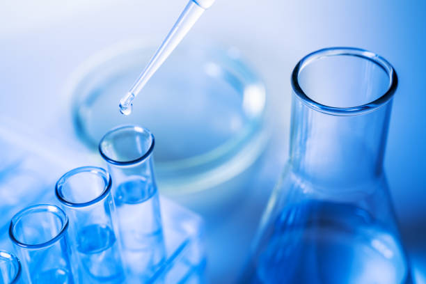 istock A scientist conducts an experiment in a laboratory. Equipment for chemical experiments. Lab technician pours a reagent into a test tube 1196004407