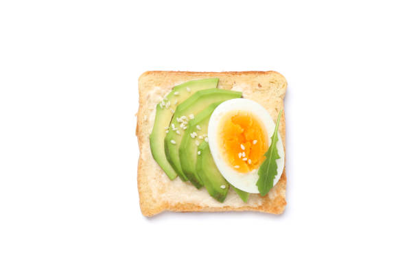 istock Toast with avocado and egg isolated on white background 1196004483