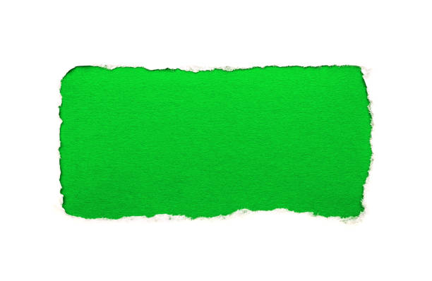 istock A hole in white paper with torn edges isolated on a white background with a bright green color paper background inside. Good paper texture 1196005871
