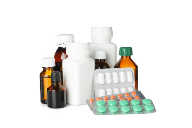 istock Medical bottles and pills isolated on white background 1196006389