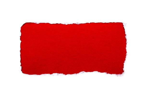 istock A hole in white paper with torn edges isolated on a white background with a bright red color paper background inside. Good paper texture. 1196006776