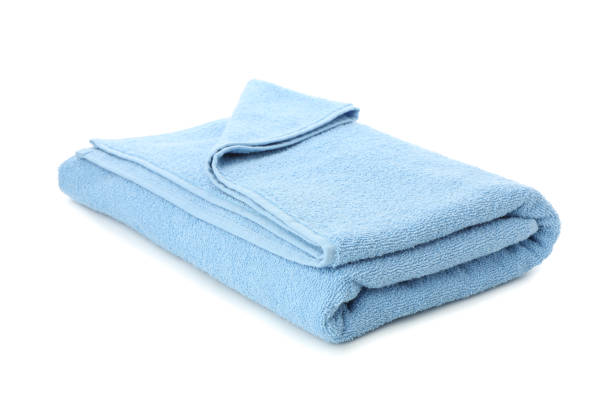 istock Folded blue towel isolated on white background, close up 1196007508