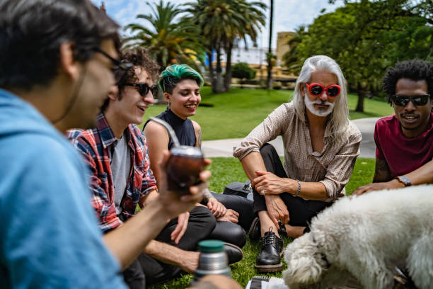 istock Professor lecturing to students in park 1196007737