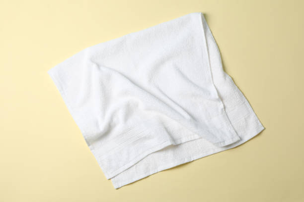 istock Fresh white towel on beige background, top view 1196008635