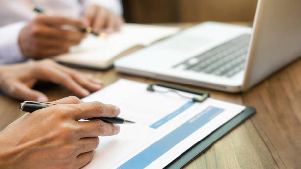 istock Business team brainstorming and discussing with financial data and report graph. Teamwork meeting working concept. 1196008786