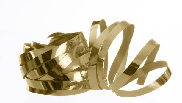 istock Shiny gold gift ribbon bundle isolated on white background. 1196008802