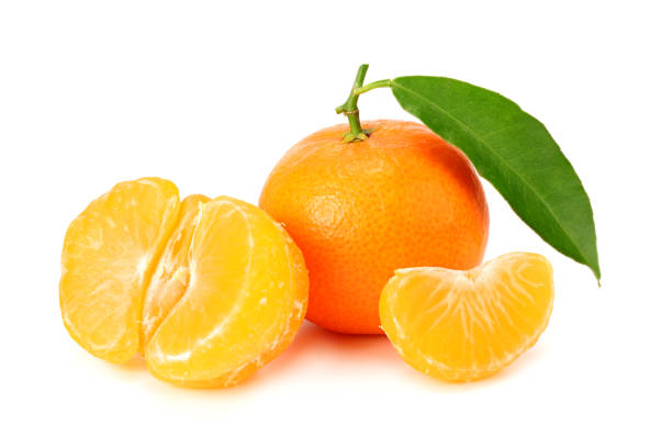 istock mandarin with slices and green leaves isolated on white background 1196009921