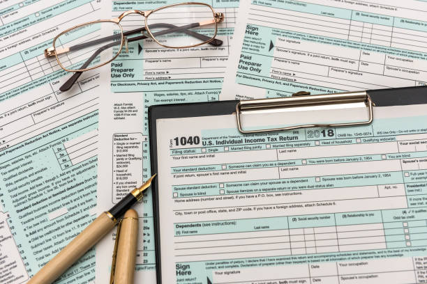 istock 1040 individual us tax form with pen 1196010626