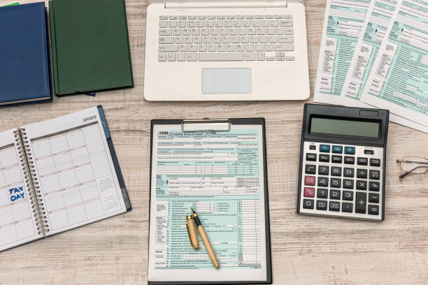 istock Opened schedule with note on April 15th. Tax day, deadline 1196010652