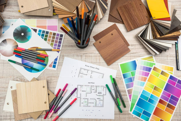 istock architectural blueprints with paper and wooden color sampler on creative desk 1196010746