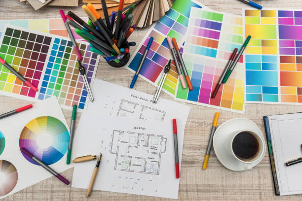 istock architectural blueprints with paper and wooden color sampler on creative desk 1196010802