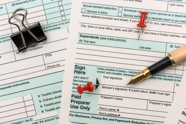 istock 1040 individual us tax form with pen 1196011721