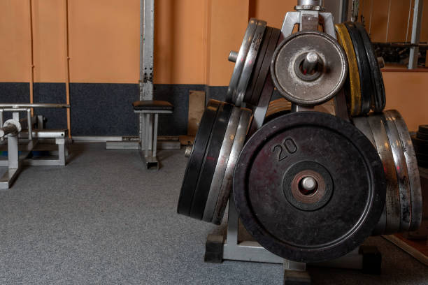 Barbell plates holder rack in the gym - Image Barbell plates holder rack in the gym - Image plate rack stock pictures, royalty-free photos & images