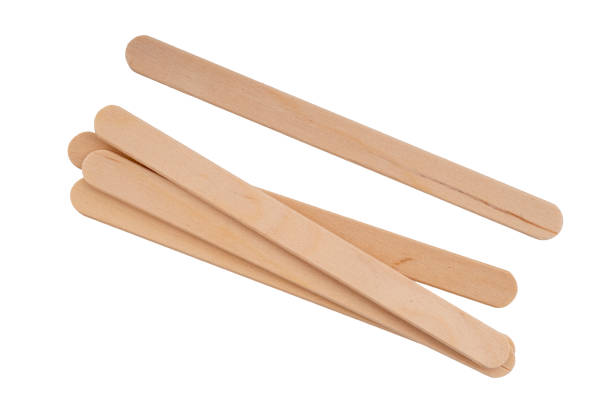 Wooden lollipop, popsicle or craft sticks, isolated on white background. Wooden lollipop, popsicle or craft sticks, isolated on white. popsicle stick stock pictures, royalty-free photos & images