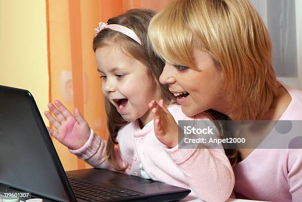 Picture Of Happy Mother And Child With Laptop Computer Stock Photo - Download Image Now