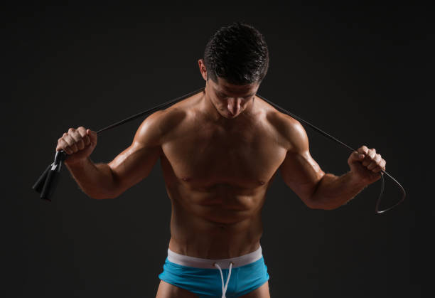Strong Muscular Men over black background