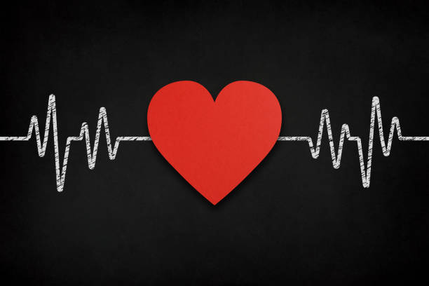 Red heart shape and heart rhythm on black background